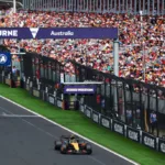F1 Australian Grand Prix, Lando Norris pole position, McLaren front row, Ferrari struggles in qualifying, Max Verstappen race preview, unpredictable Melbourne weather.